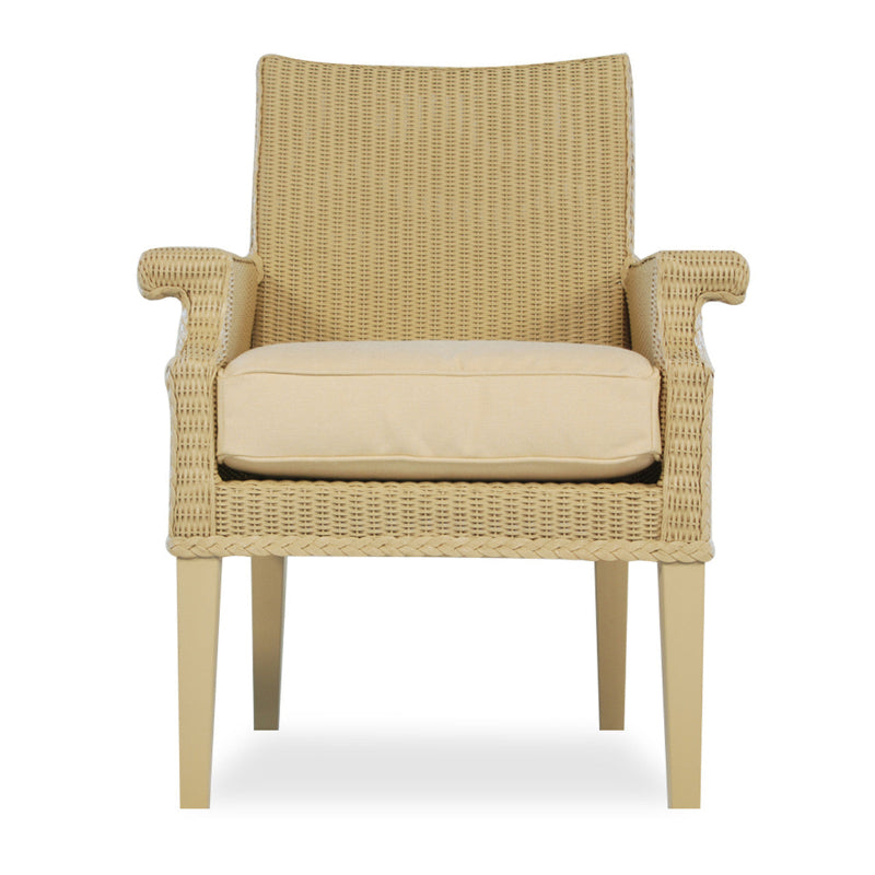 Beige wicker armchair with a cushion on a white background