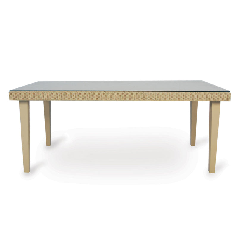 A rectangular wicker dining table with a gray tabletop and beige frame.
