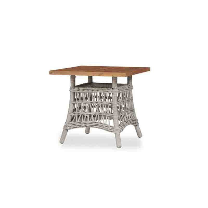 Square side table with wooden top and wicker base on a white background