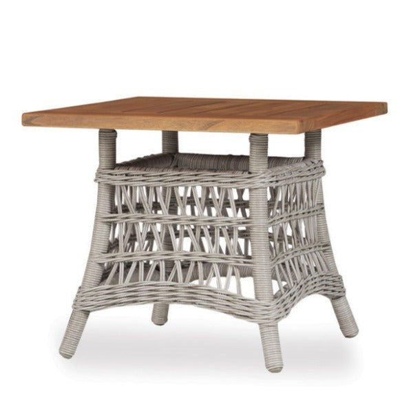 A square-shaped outdoor end table with a teak wood top and a gray woven vinyl base, inspired by the Mackinac Island design.