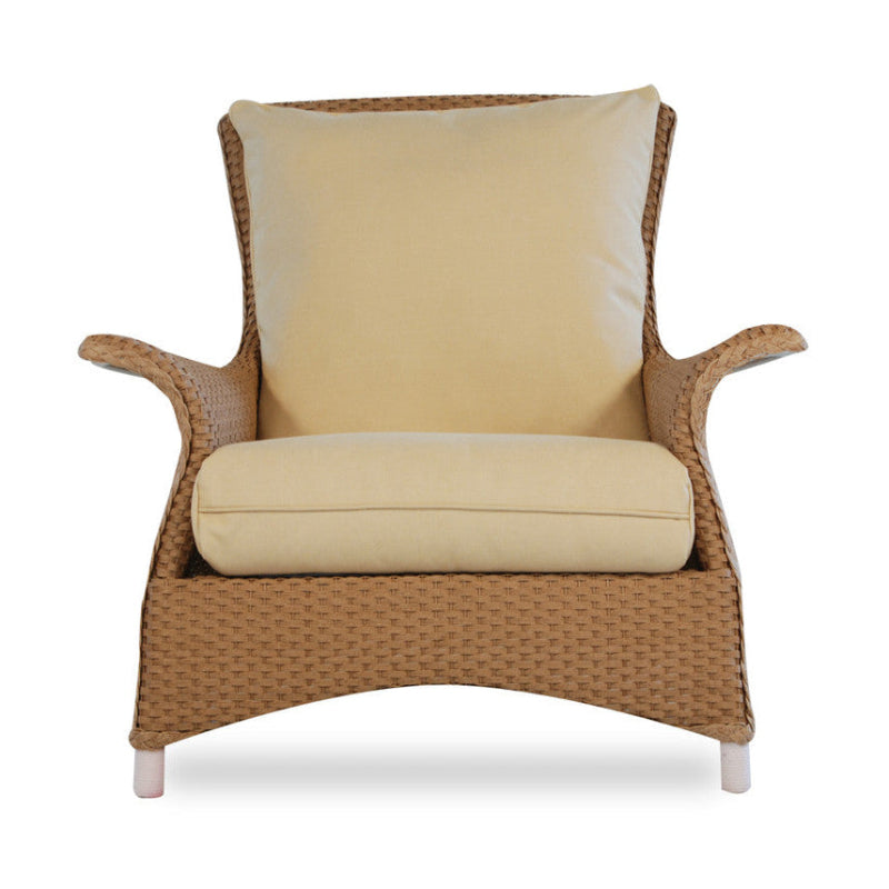 Wicker chair with beige cushions on a white background