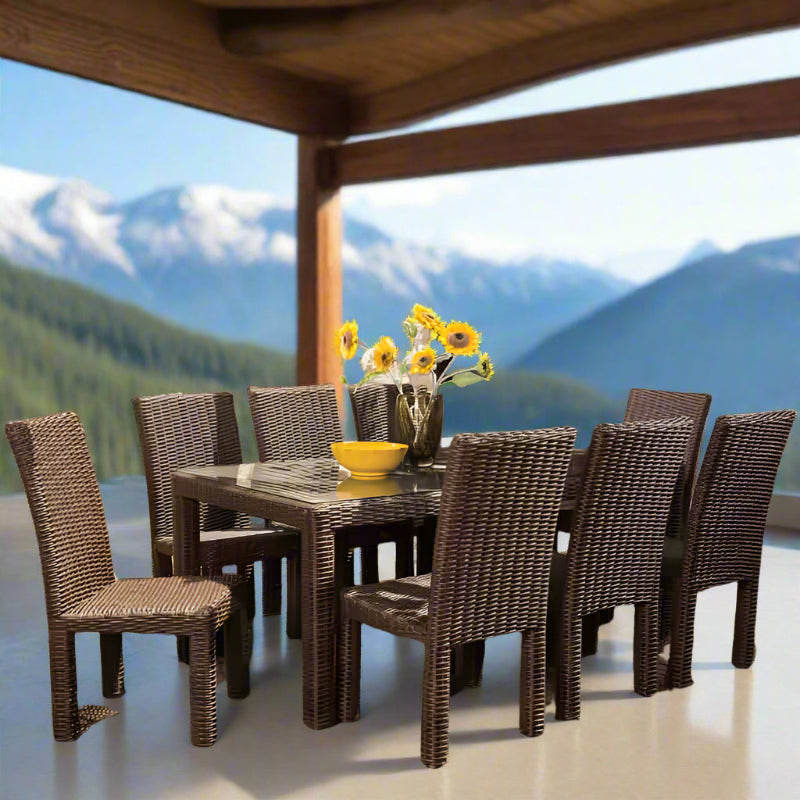 Outdoor dining set with a table and chairs on a patio with mountain view