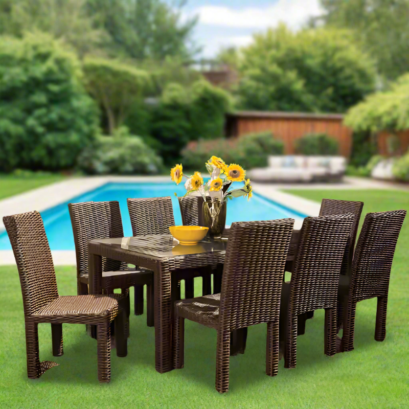 Outdoor patio set with table and chairs by a pool