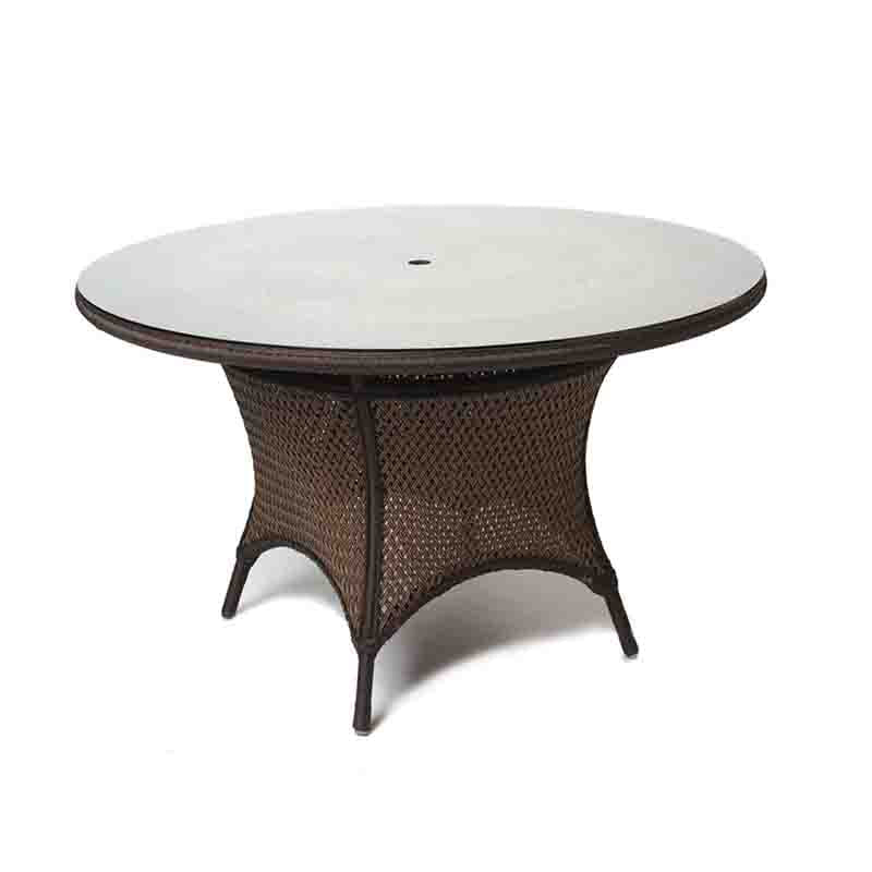 Round wicker table with a white marble top on a white background