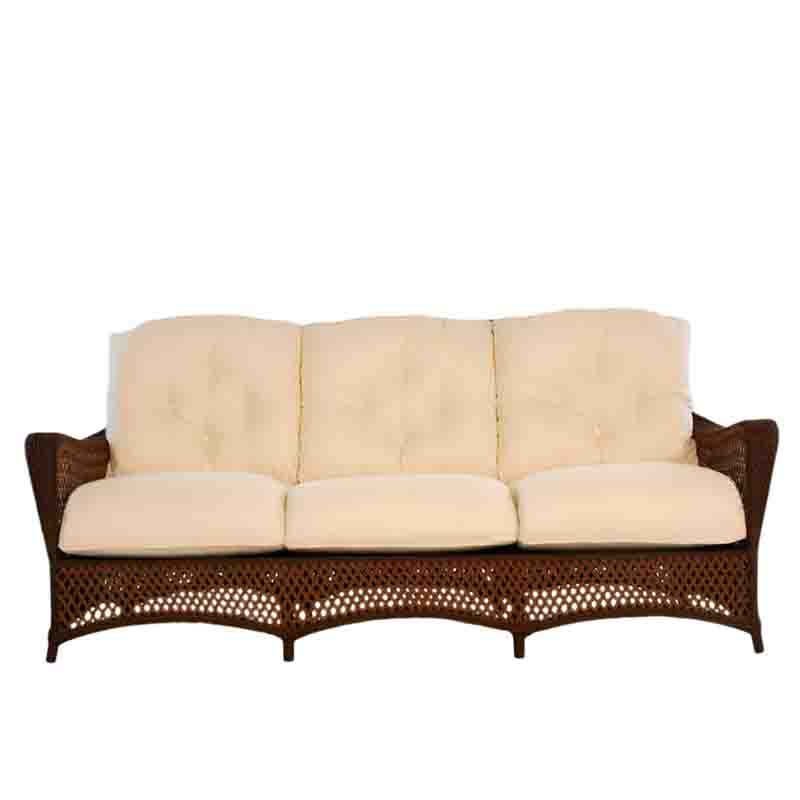 Wicker outdoor sofa with beige cushions on a white background