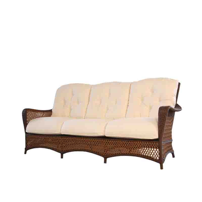 Wicker outdoor sofa with beige cushions on a white background