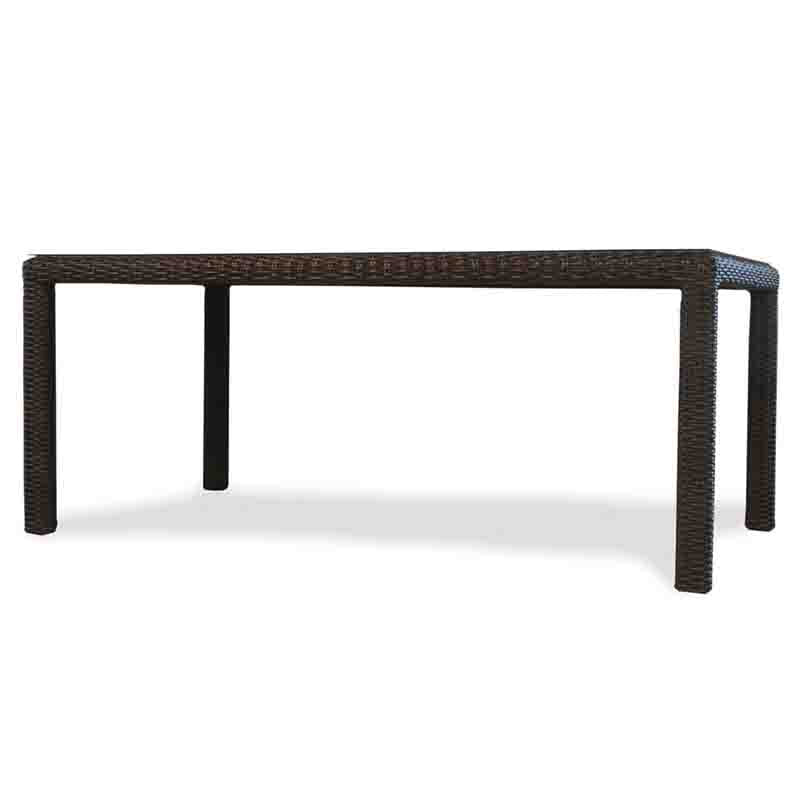 Rectangular outdoor table with wicker design on a white background
