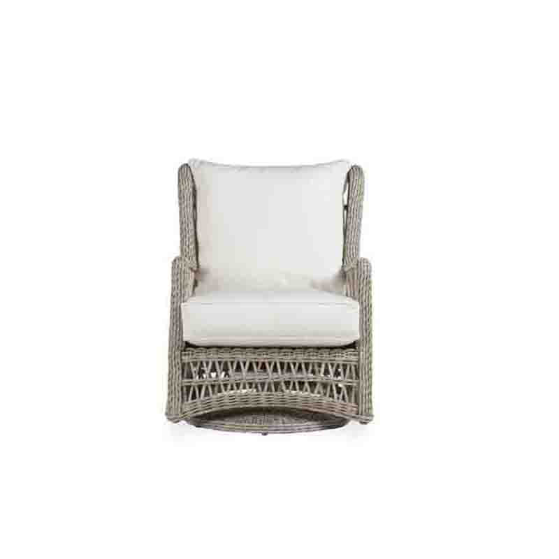 Wicker chair with white cushions on a white background