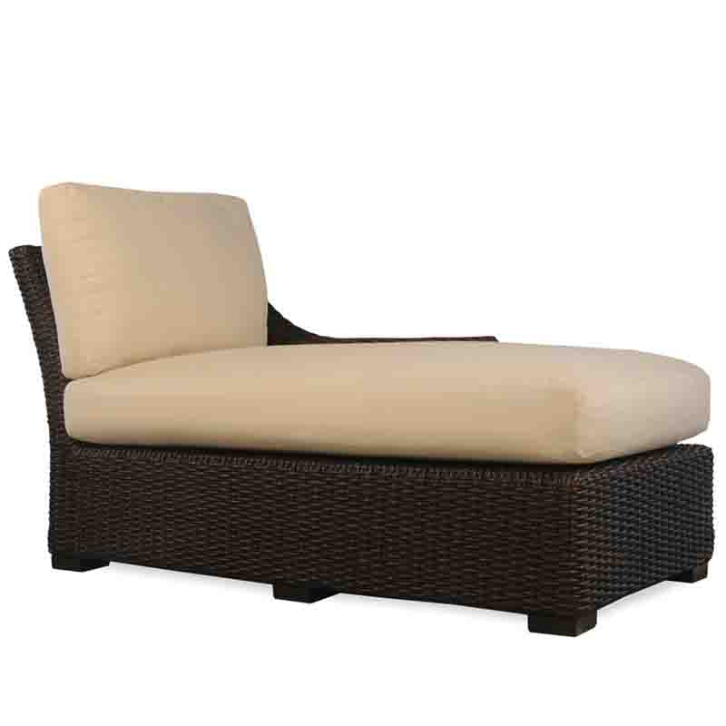 Wicker outdoor lounge chair with beige cushions on a white background