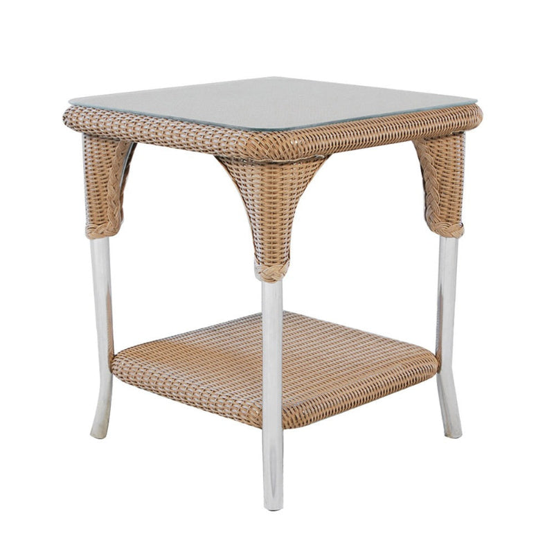 Wicker side table with a white top on a white background