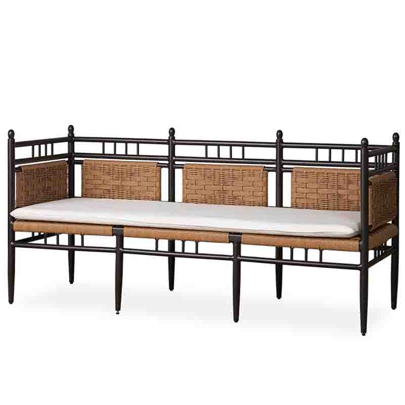 Wicker bench with black metal frame and white cushion on a white background
