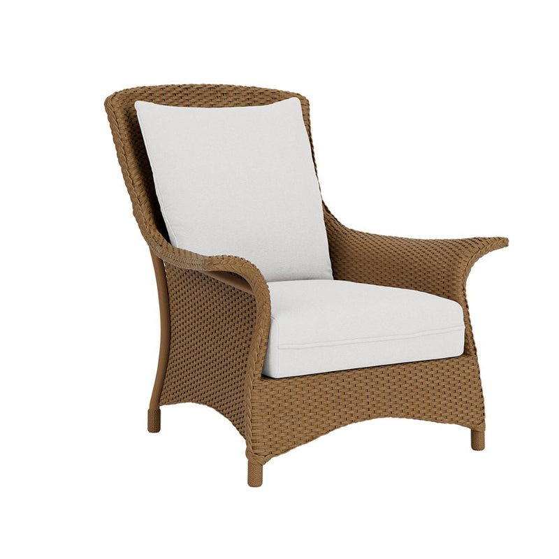 Wicker chair with white cushion on a white background