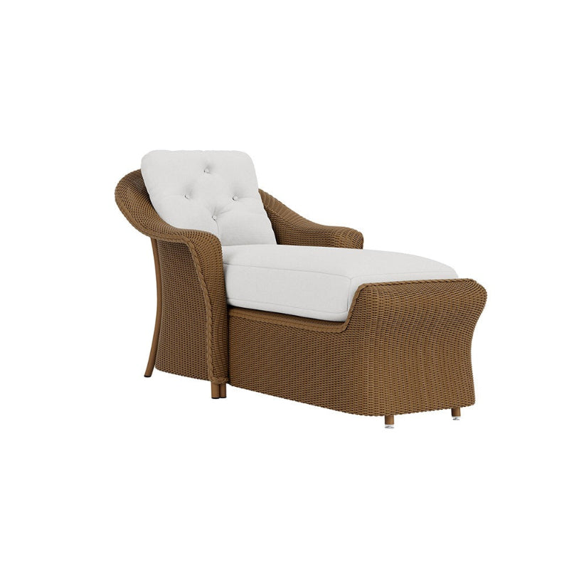 Brown wicker chair with white cushions on a white background