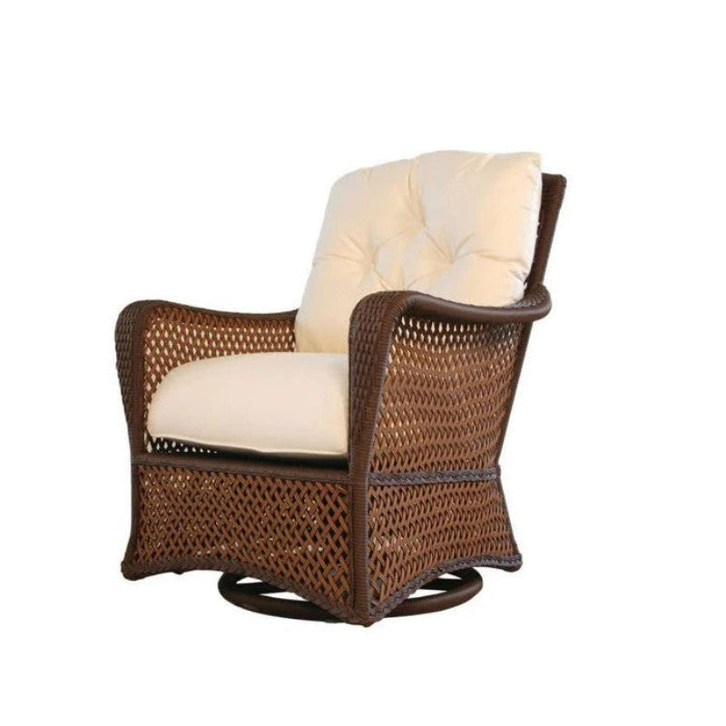 Wicker armchair with beige cushions on a white background