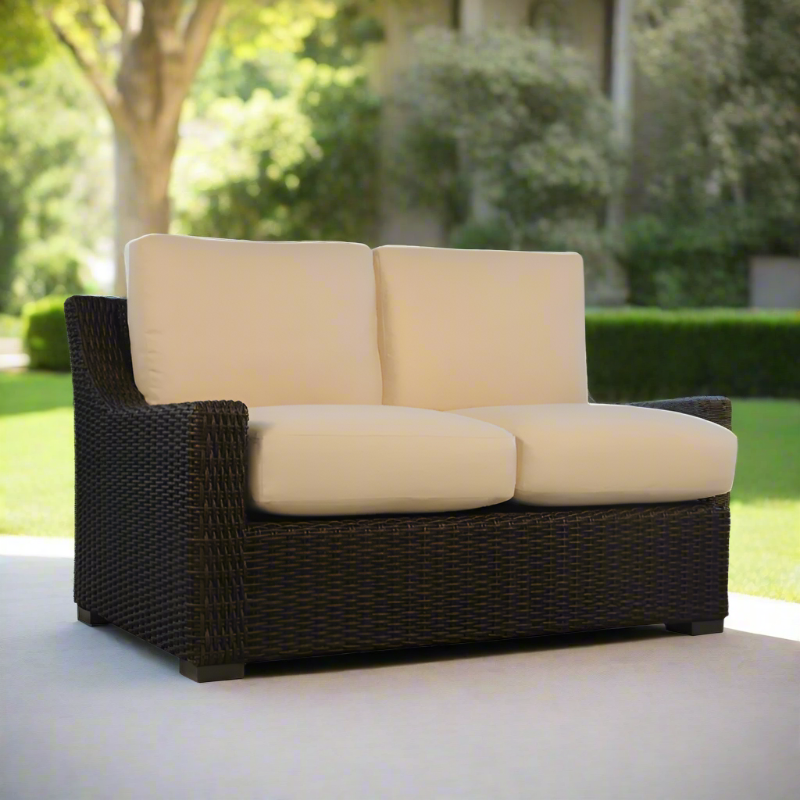 Outdoor sofa with beige cushions on a patio