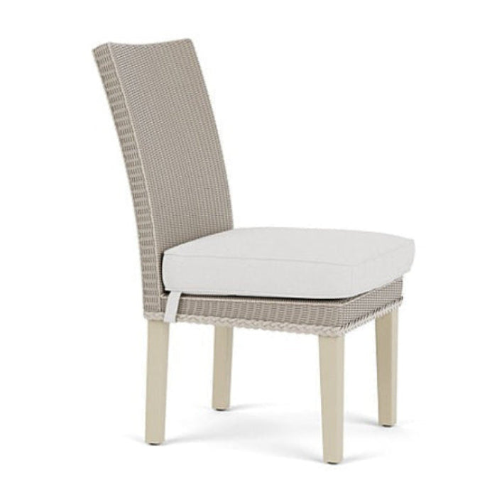 Chair with woven backrest and white cushion on a white background