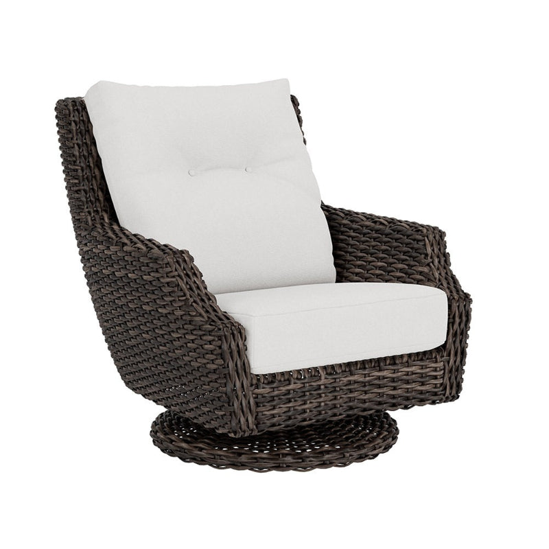 Wicker chair with white cushion on a white background