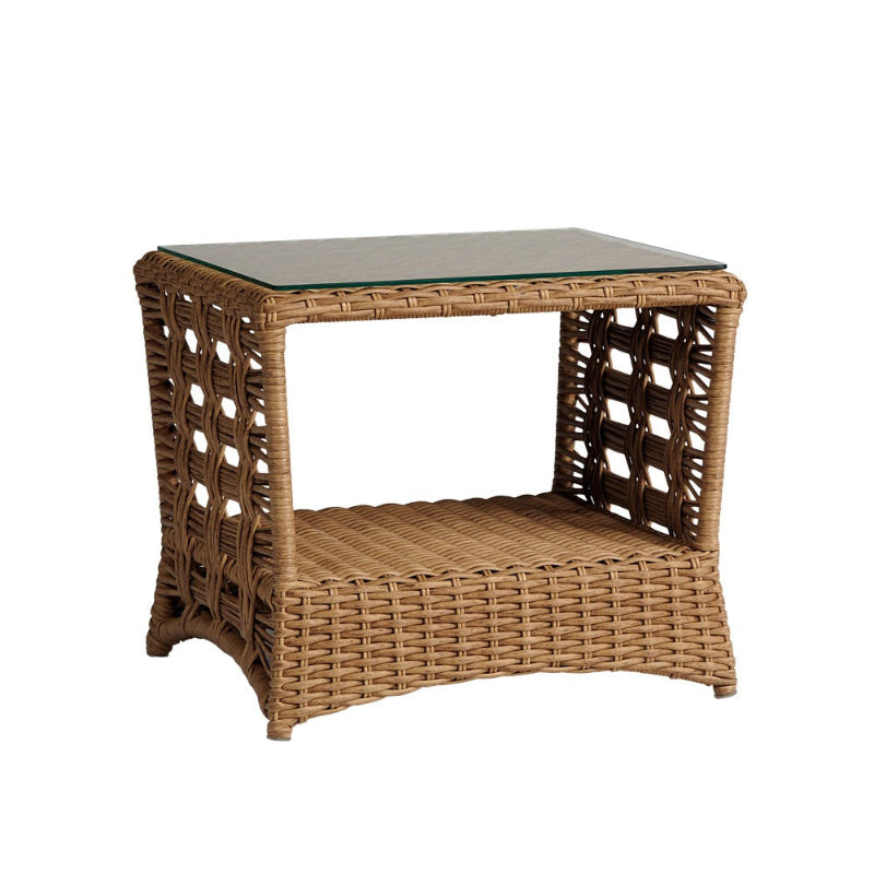 Wicker side table with glass top on a white background