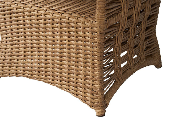 Close-up of a wicker chair corner on a white background