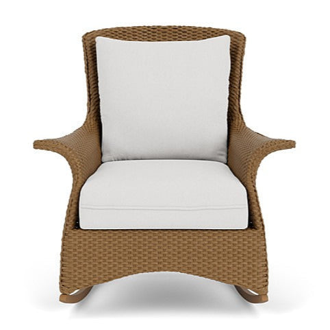 Wicker chair with white cushions on a white background