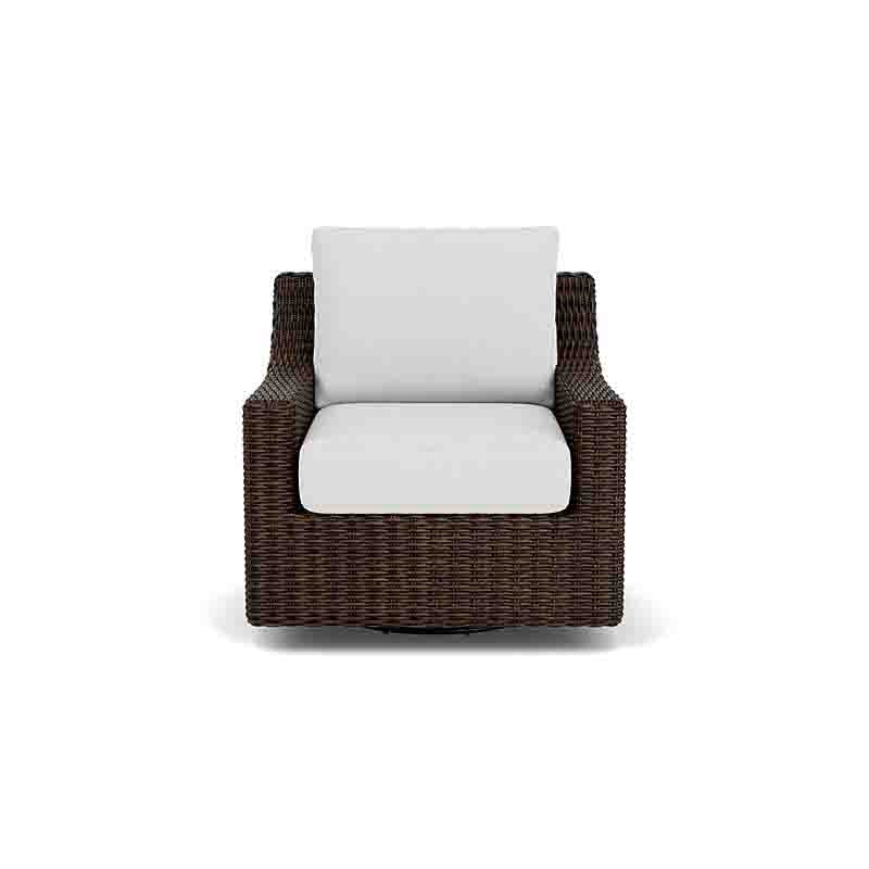 Wicker armchair with white cushions on a white background