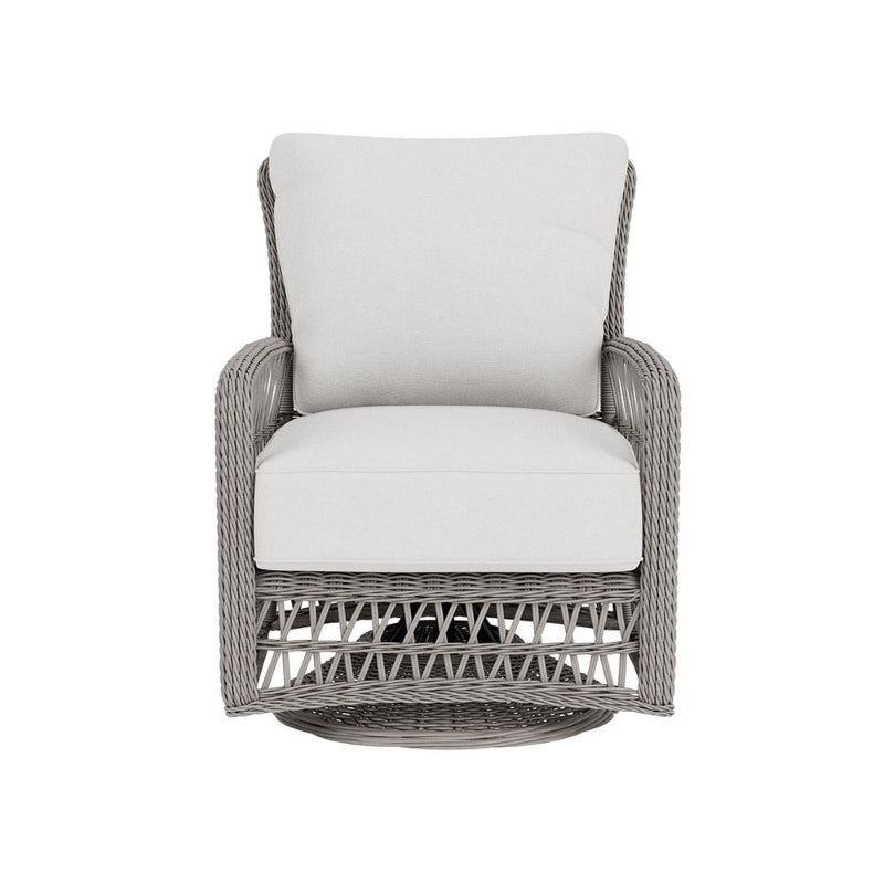 Wicker chair with white cushion on a white background