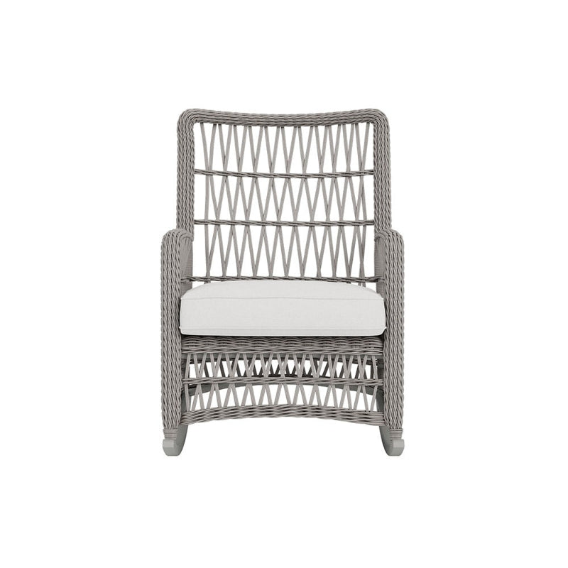 Wicker chair with a white cushion on a white background