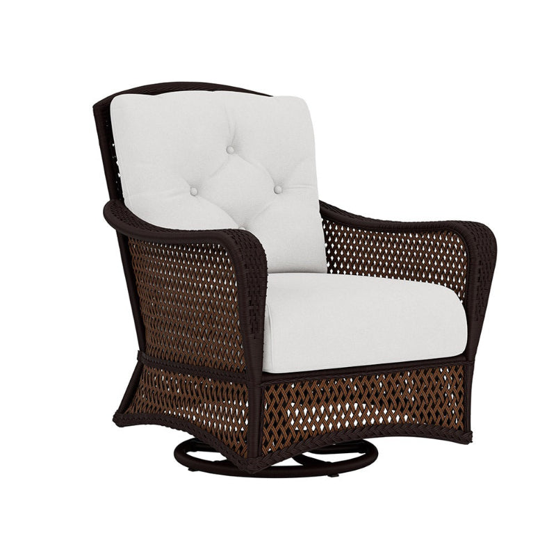 Wicker chair with white cushion on a white background