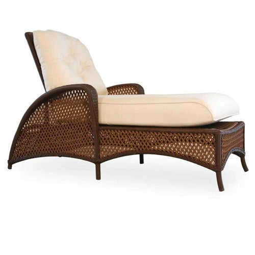 Wicker lounge chair with beige cushions on a white background