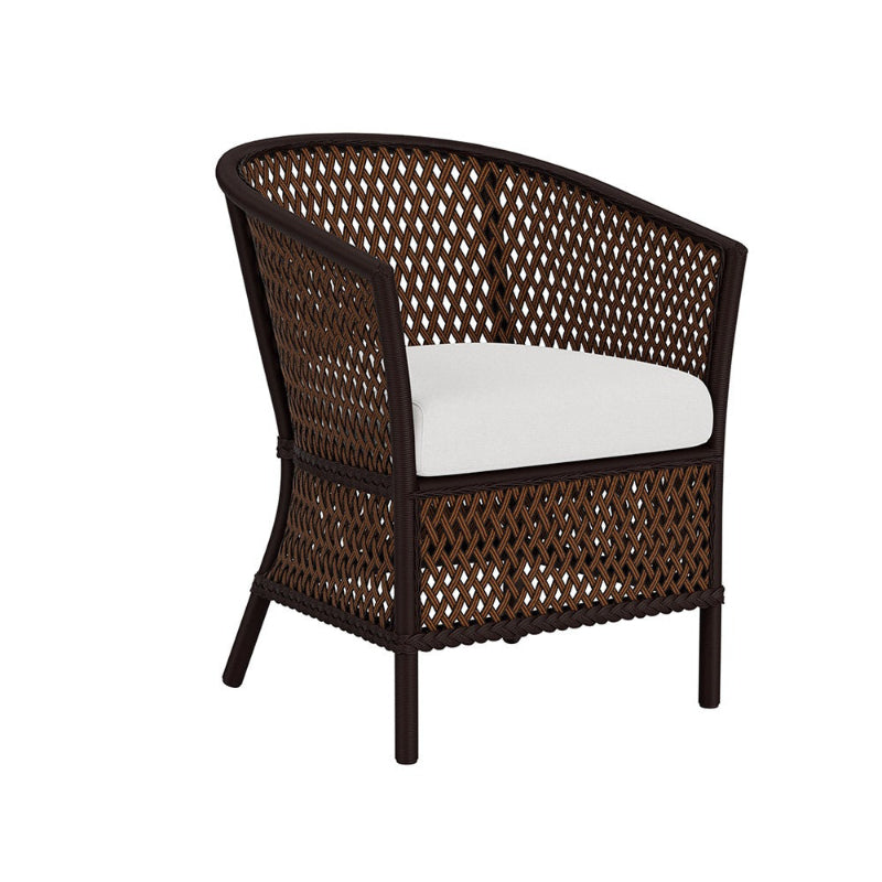 Wicker chair with a white cushion on a white background