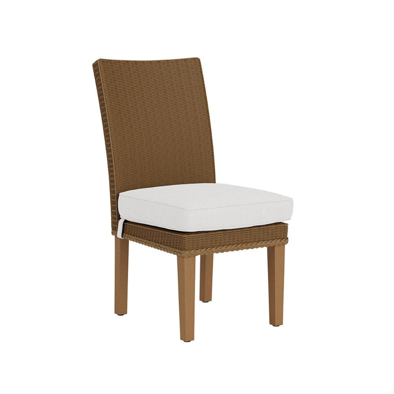 Brown wicker chair with a white cushion on a white background