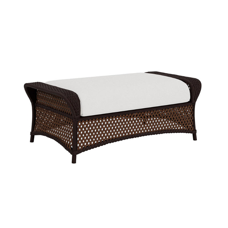 Wicker bench with white cushion on a white background