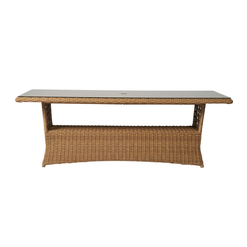 Wicker coffee table with a white marble top on a white background