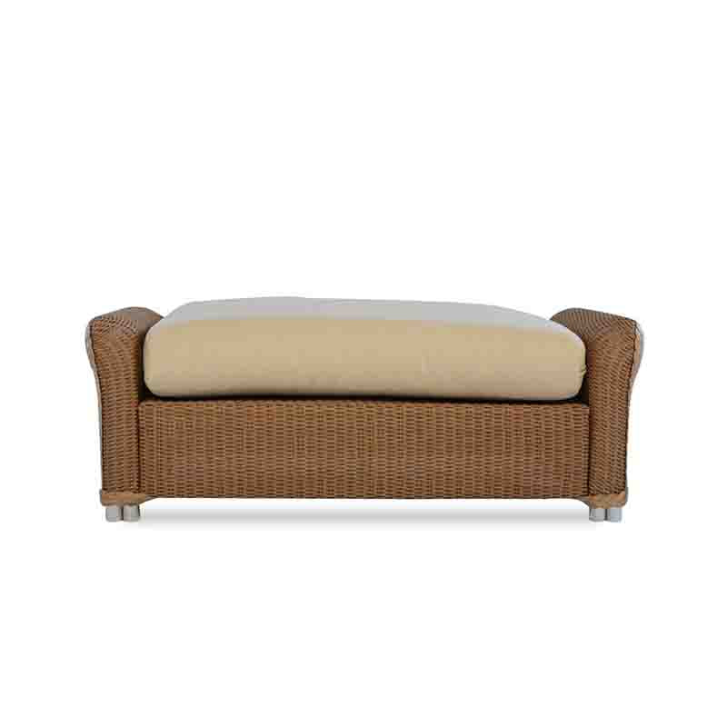 Wicker bench with beige cushion on a white background