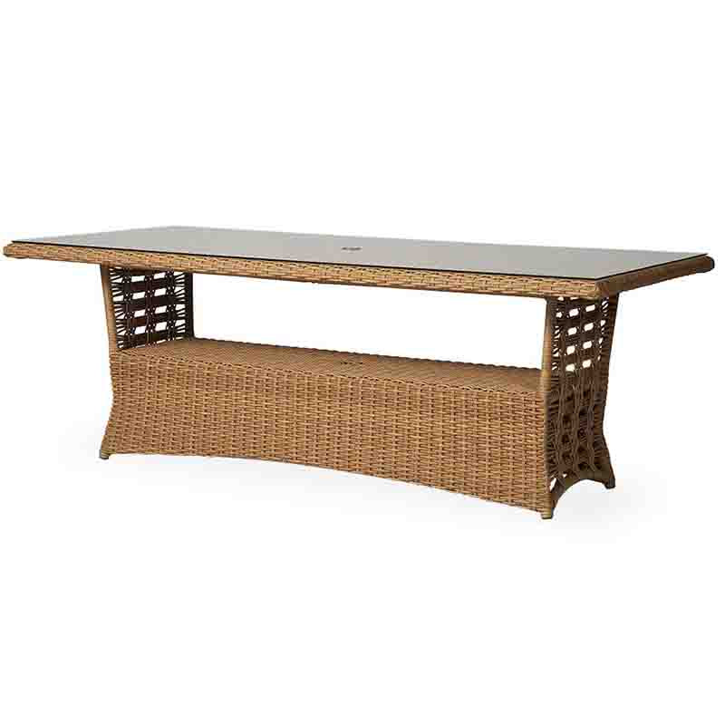 Wicker outdoor table with glass top on a white background