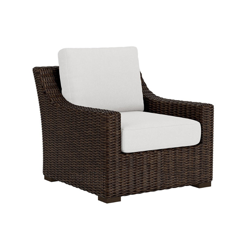 Wicker armchair with white cushion on a white background