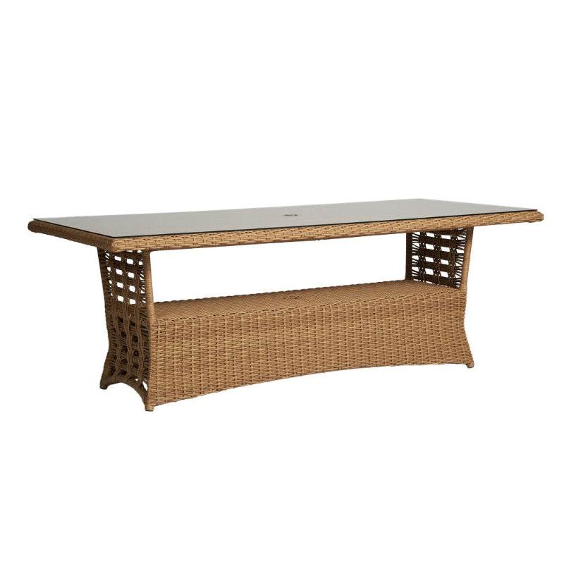 Wicker outdoor table with a white top on a white background