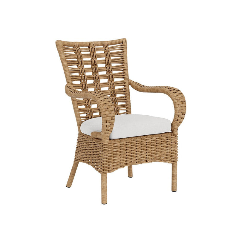Wicker chair with white cushion on a white background