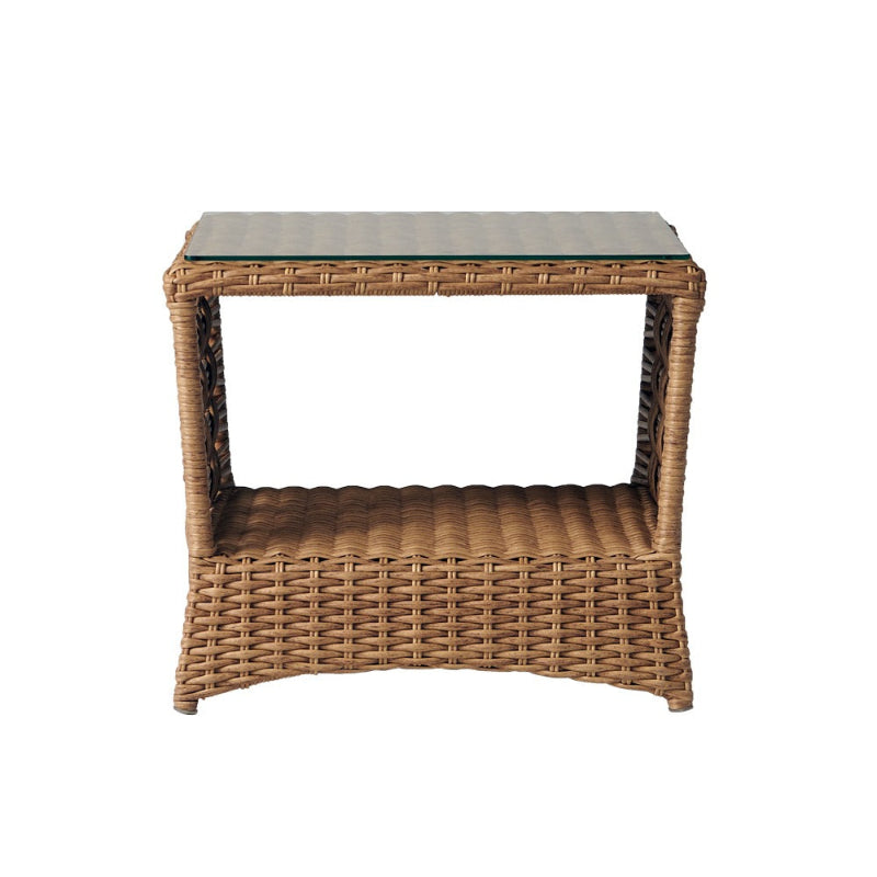 Wicker side table with a glass top on a white background