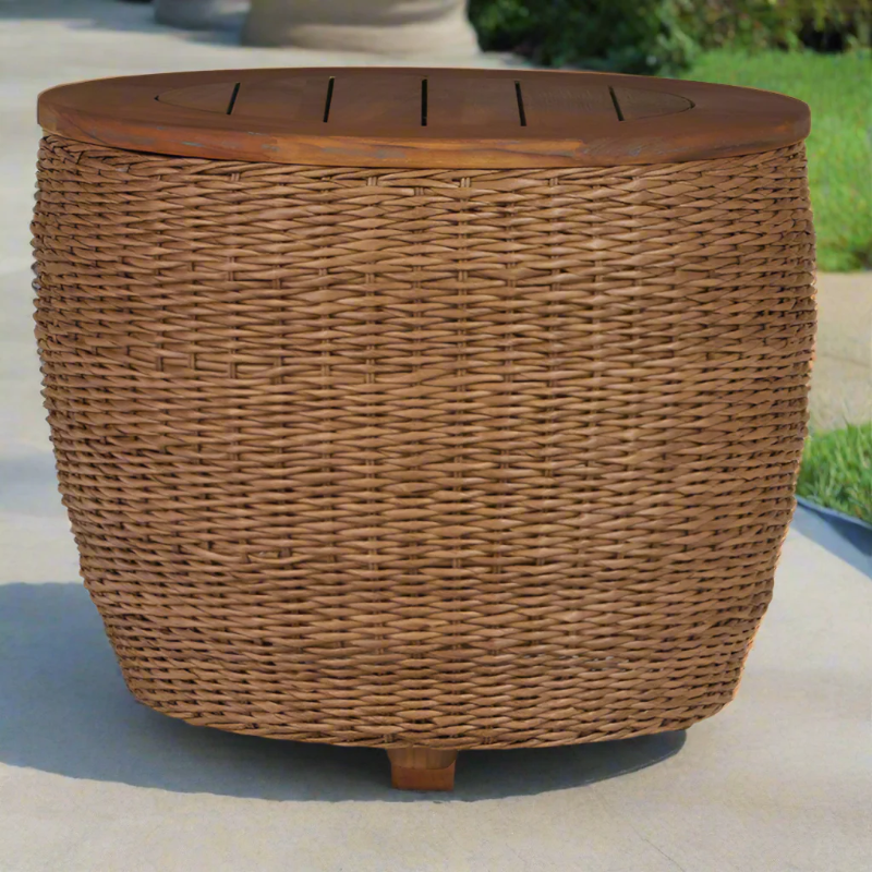Wicker side table with a wooden top on a patio