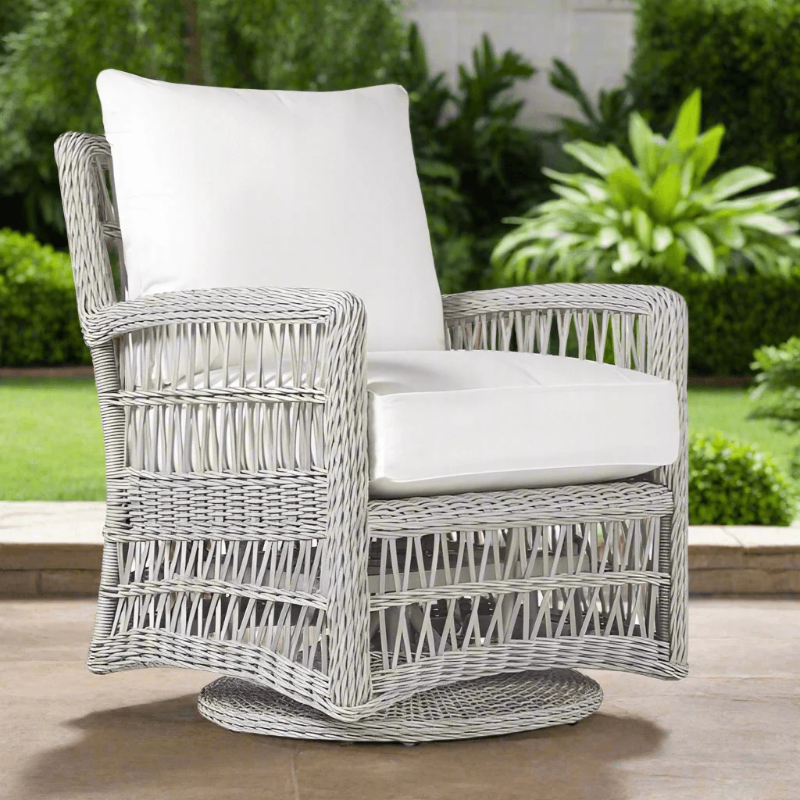 White wicker chair with cushions on a patio