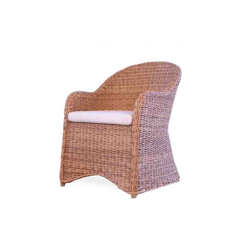 Wicker chair with a white cushion on a white background
