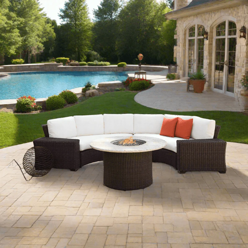 Outdoor patio set with fire pit table near a pool and house