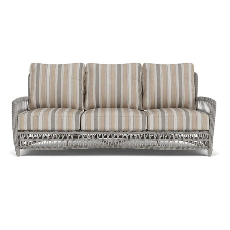 Sofa with striped cushions on a white background