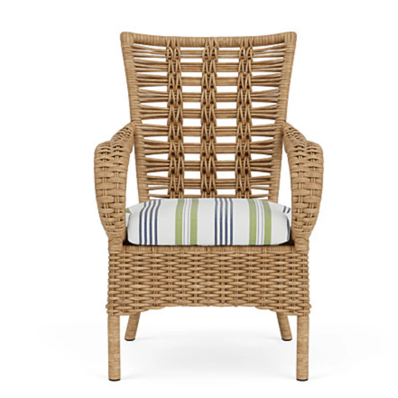 Wicker armchair with a striped cushion on a white background
