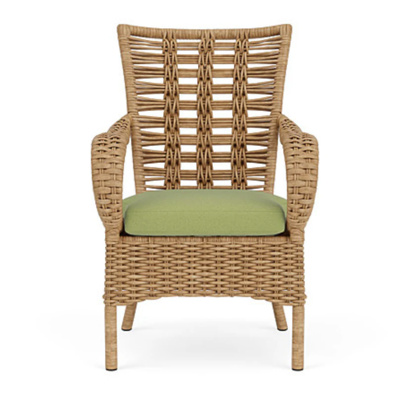 Wicker armchair with a green cushion on a white background