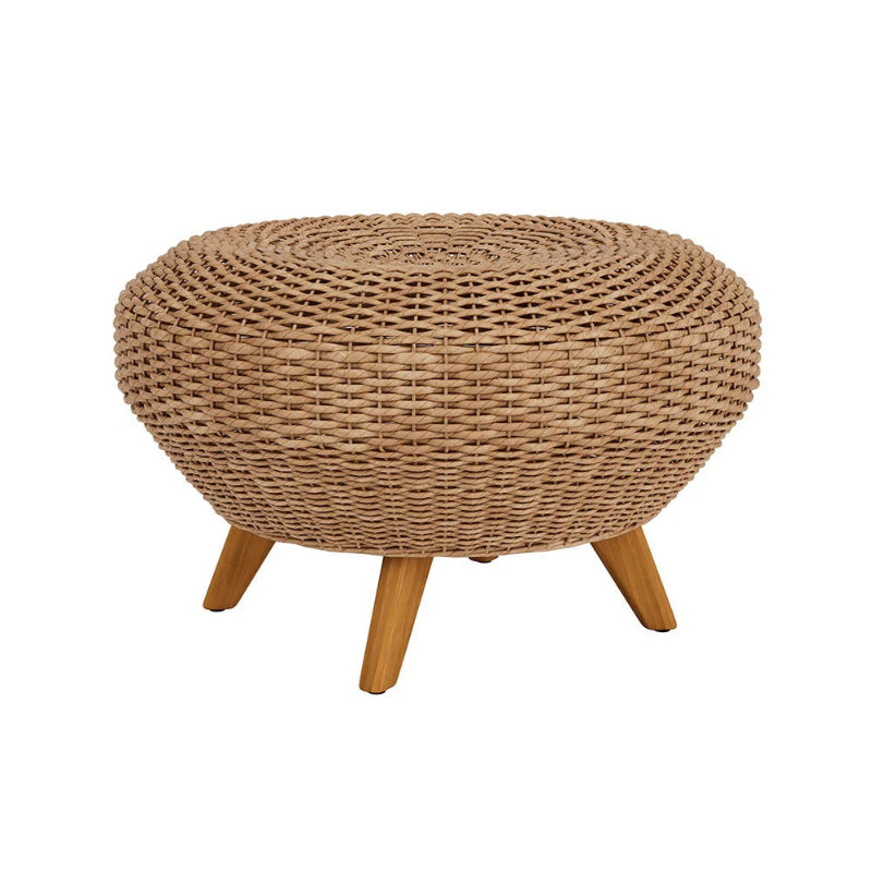 Round woven ottoman with wooden legs on a white background