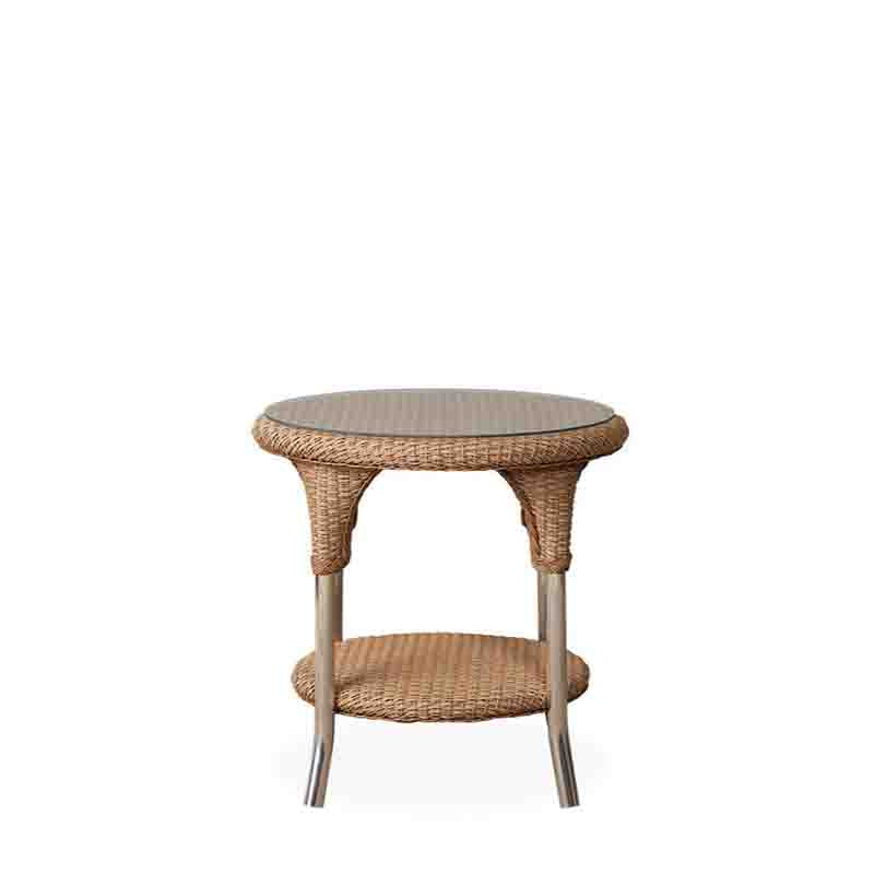 Round wicker side table with glass top on a white background