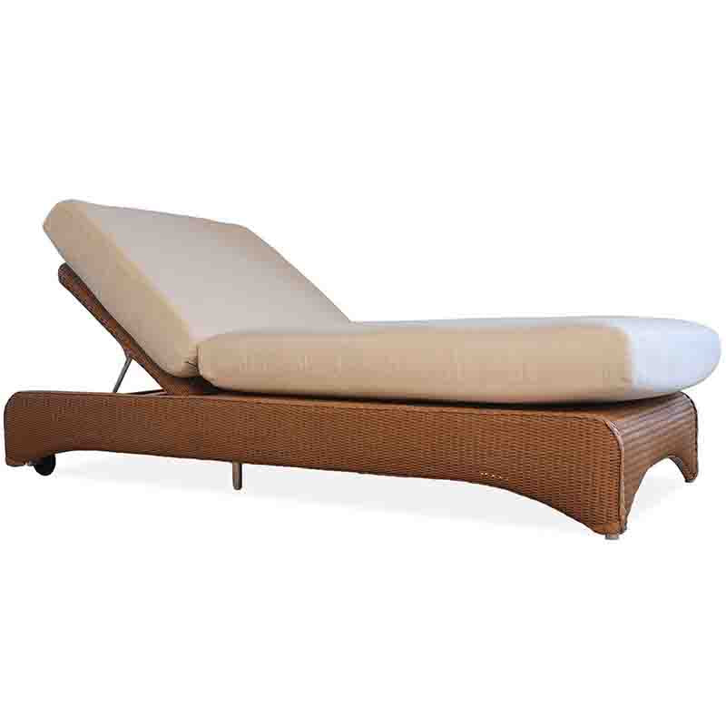 Beige outdoor lounge chair with wicker frame on a white background
