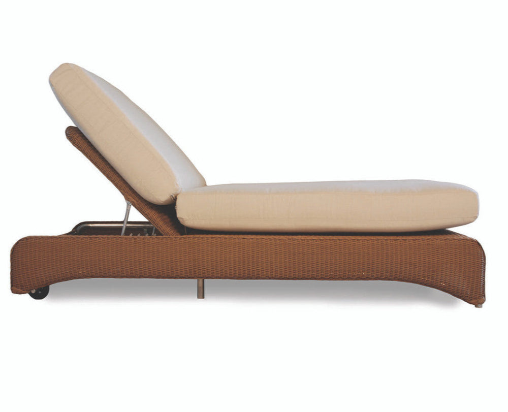 Beige outdoor lounge chair with wicker frame on a white background